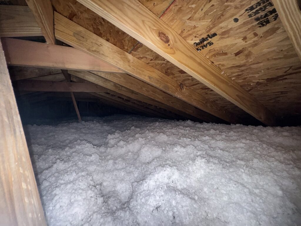 A newly insulated attic space with blown-in insulation by Absolute Pro Insulation in Corpus Christi, TX.