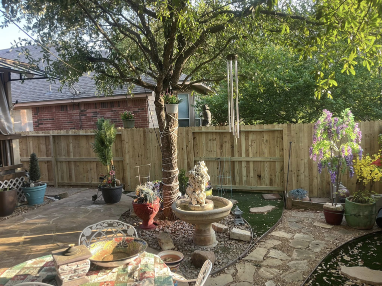 A beautifully completed backyard fence installation, demonstrating the quality work of Triple A' Construction in San Antonio, TX.