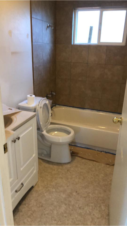 A newly completed bathroom renovation with new fixtures by Changing Spaces Construction LLC in Portland, OR.