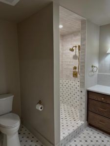 A completed bathroom renovation featuring a walk-in shower and new vanity by Le Roux Homes in Enid, OK.