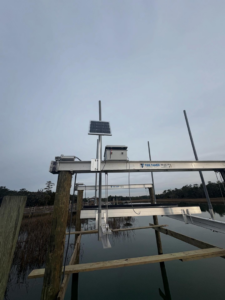 A newly installed boat lift with a solar panel, completed by Coastal Dock and Resurfacing in Beaufort, SC.