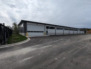 Exterior view of a completed commercial building with a large parking lot, a project by Integrated Building Systems, Inc. in Westmont, IL.