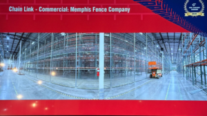 A panoramic view of a completed commercial chain link fence installation inside a warehouse by Memphis Fence Company, LLC in Memphis, TN.