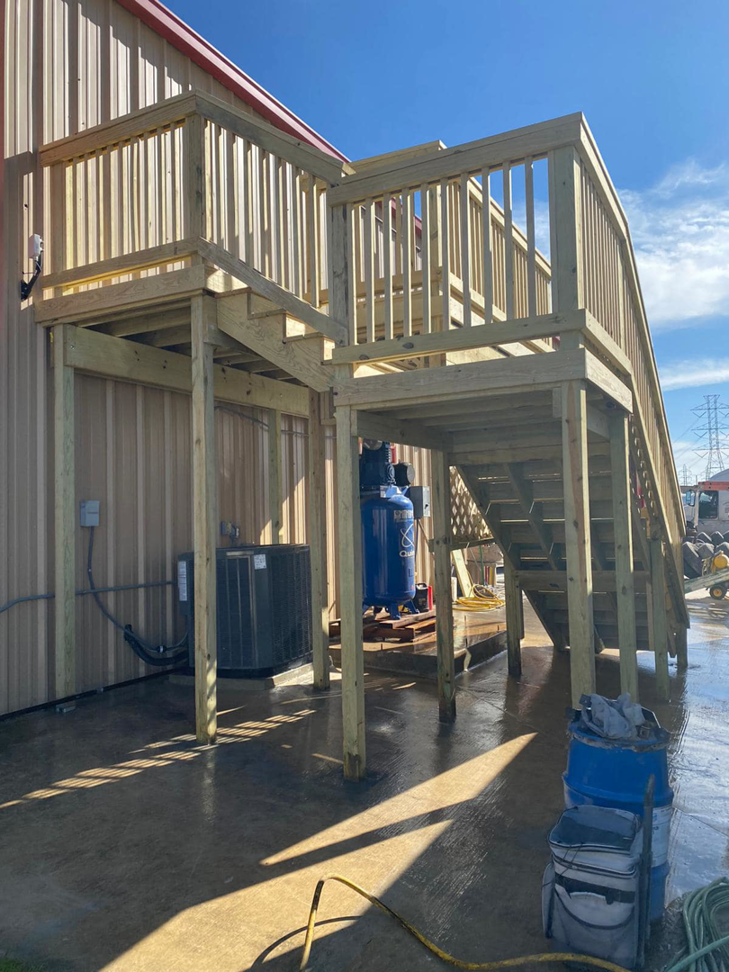Completed commercial wooden deck and stairs built by JP Construction in San Antonio, TX.