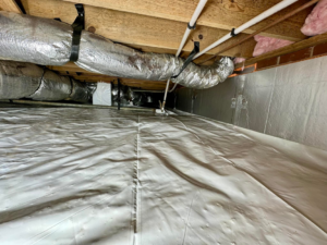 A completed crawlspace sealing project with a clean vapor barrier and insulation by Ramos Waterproofing & Crawlspace Sealing LLC in Durham, NC.