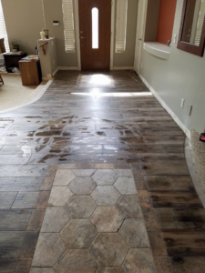 A completed entryway floor featuring a mix of hexagonal and plank tiles by Clayton Family Tile, LLC in Chandler, AZ