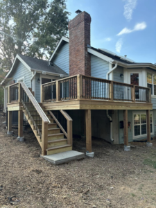 A beautifully completed exterior deck and stairs built by Top Gunn Family Construction in Truxton, MO.