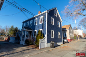 A newly renovated blue house exterior, a completed project by Mendez Contractor Inc in Lynn, MA