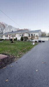 A residential house with a newly completed gray shingle roof installation by Joe's Roofing in Strongsville, OH.