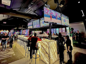 A beautifully completed illuminated marble bar in a commercial venue, showcasing a general contractor project by COMAF Marble & Granite in El Paso, TX.