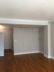 A newly renovated interior room with hardwood floors and crown molding by Kennyman The Handyman Inc. in San Francisco, CA