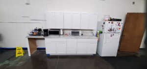 Newly installed white kitchen cabinets and countertop by Justin-case Repairs in Ankeny, IA.