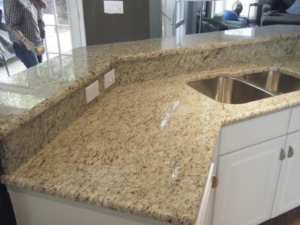 A completed kitchen granite countertop installation with a double sink by AZ Custom Granite in Glendale, AZ.