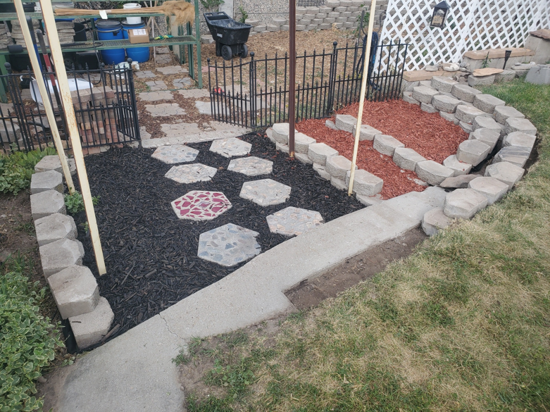 A completed landscaping and hardscaping project by Papa Bear's Home Care in West Valley City, UT.