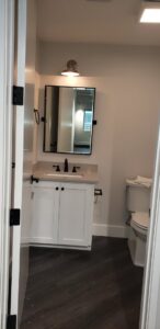 A beautifully completed modern bathroom renovation by Gourley Contractors, LLC, in Corpus Christi, TX.