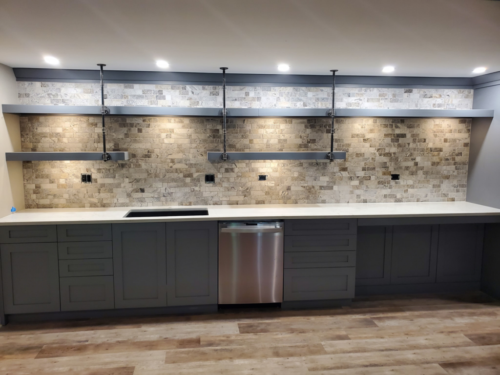A beautifully completed modern kitchen remodel featuring new cabinets, countertops, and backsplash by Tile Works inc in Naperville, IL.
