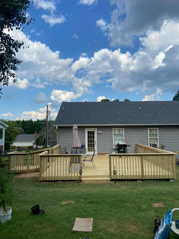 A completed new wooden deck and ramp installation by LDT Construction Services in Spring Hill, FL.