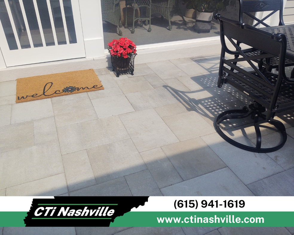 A completed outdoor patio featuring neatly laid square pavers, a quality handyman service by CTi Nashville in Antioch, TN.