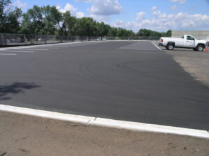 A completed parking lot paving project with new line markings by Buck Blacktop Inc in Little Canada, MN.
