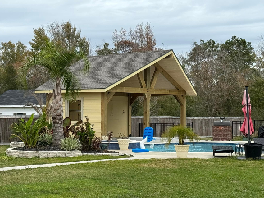 A newly completed pool house or covered patio built by Royal Construction & Remodeling, Inc. in Lake Charles, LA.