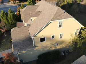 A newly installed shingle roof on a residential house, completed by First Choice Roofing in Cary, NC.