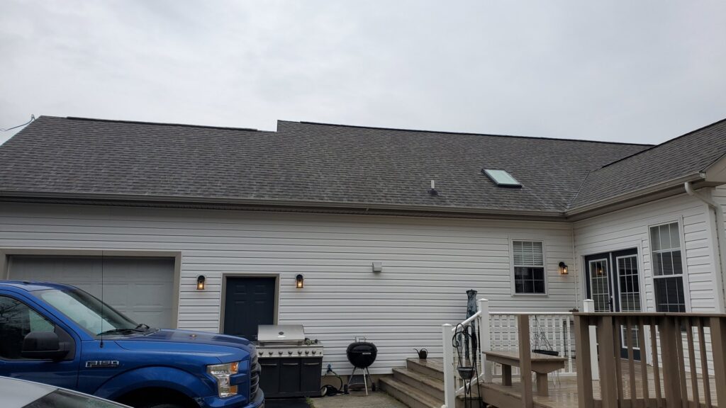 A completed roof and skylight installation on a residential home by Bayside Exteriors in Lewes, DE.