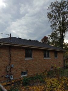 A completed roof installation on the back of a brick house by Pro Home Solutions in Aiken, SC.