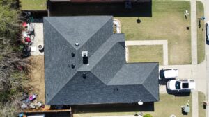 Top-down aerial view of a newly completed roof by Canek Construction LLC in Fort Worth, TX