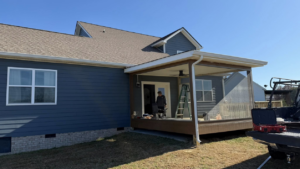 A newly completed screened-in porch and deck addition to a house by M&M Handyman Services LLC in Clarksville, TN.