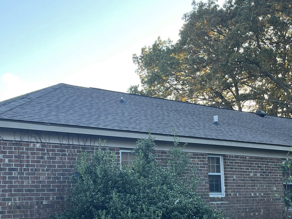 Newly installed dark shingle roof on a residential home, completed by Skyline Roofing L.L.C in Jackson, TN.