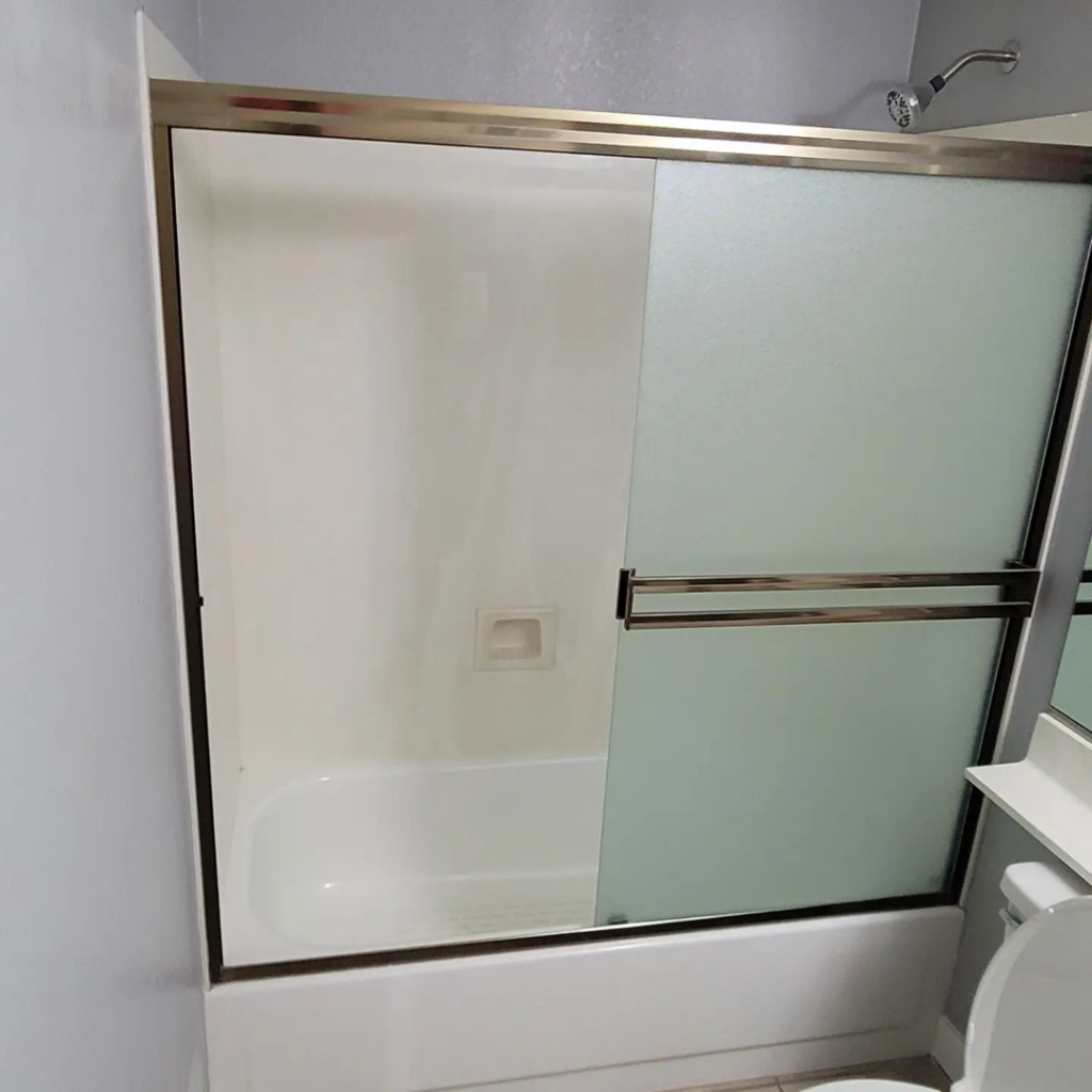 A completed shower and tub installation with a new sliding glass door by Tier 1 Contracting Inc. in Apache Junction, AZ.