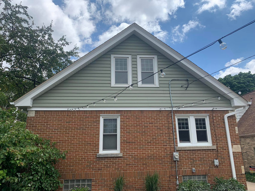 Completed siding installation on the side of a house by Sockett Siding, LLC in Milwaukee, WI