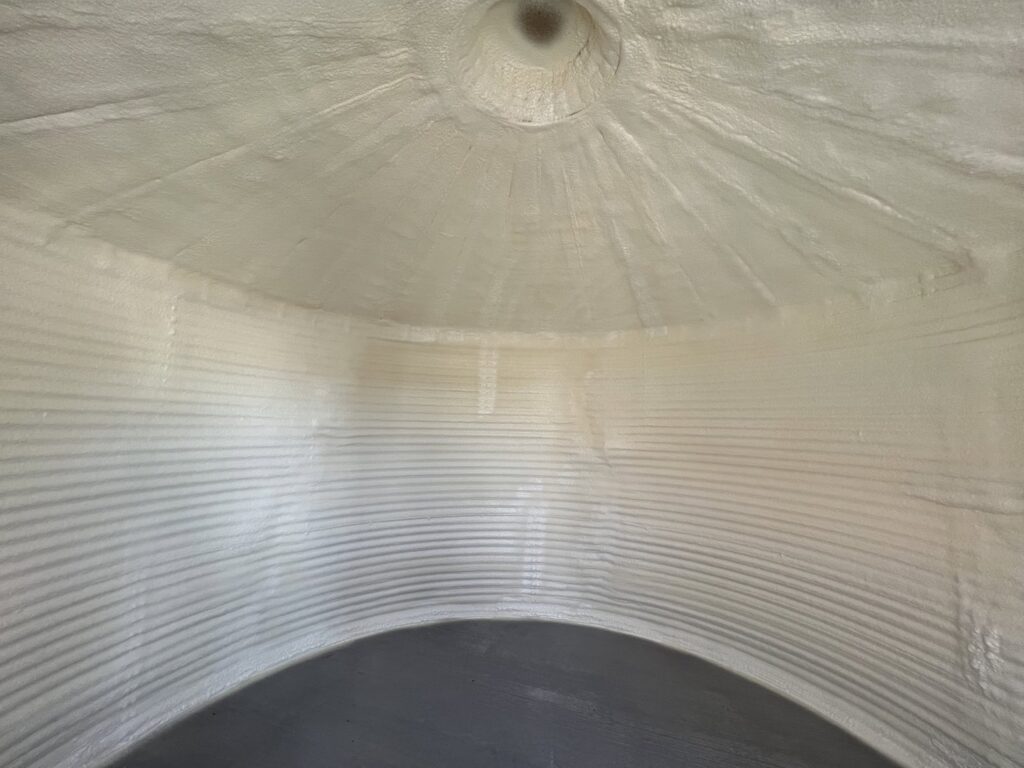 Completed spray foam insulation on the interior of a Quonset hut by Off-Axis Spray Foam and Radon Services in Clarksville, TN.