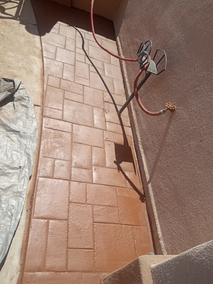 A completed stamped concrete walkway section by ORG Handyman Services in Las Cruces, NM.