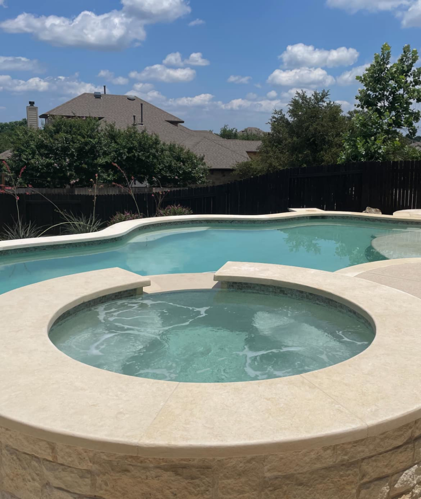 A beautifully completed swimming pool and hot tub project by 5 Daughters Total Outdoors in Austin, TX.