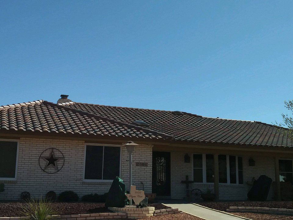 The exterior of a house featuring a completed tiled roof, a project by Campos & Son Roofing and Construction in El Paso, TX