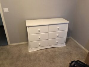 A fully assembled white dresser with six drawers, showcasing completed furniture assembly services by The ABQ Handyman in Albuquerque, NM.