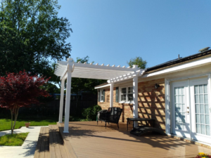 A beautifully completed white pergola installed over a deck by Signature Deck & Pergola in Virginia Beach, VA