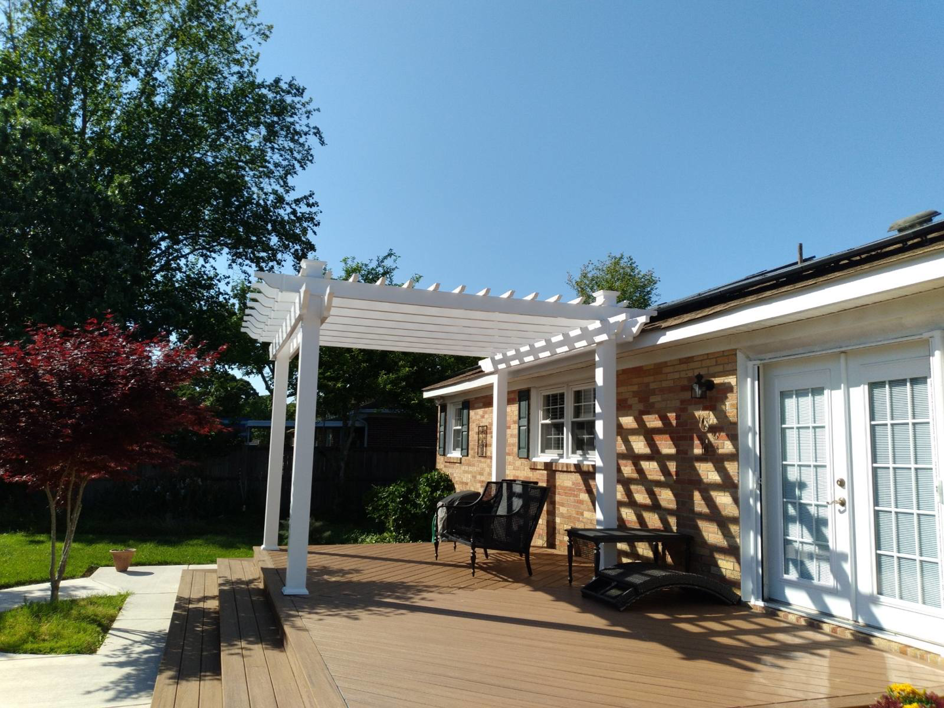 A beautifully completed white pergola installed over a deck by Signature Deck & Pergola in Virginia Beach, VA