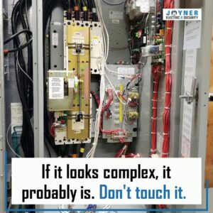 A complex electrical panel with intricate wiring, showcasing the expertise of Joyner Electric And Security in Savannah, GA.