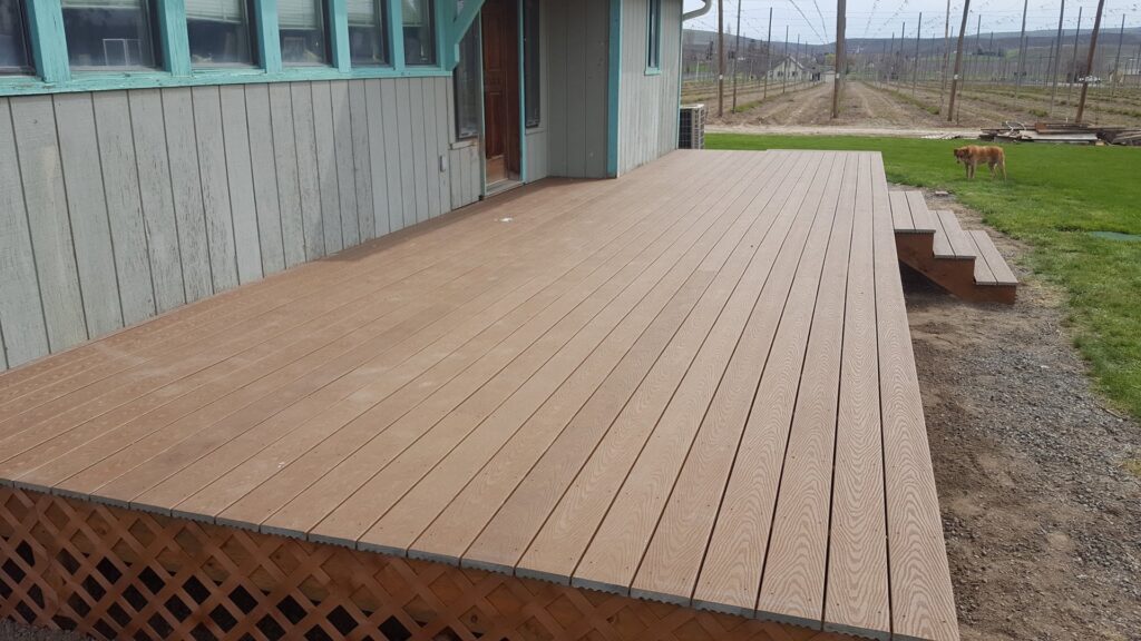 A spacious outdoor composite deck installation, a handyman service provided by TPF Services in Yakima, WA.