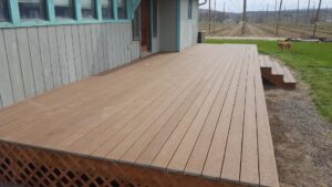 A spacious outdoor composite deck installation, a handyman service provided by TPF Services in Yakima, WA.