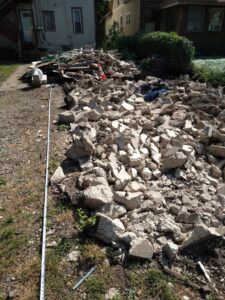 A large pile of concrete demolition debris awaiting removal by Cash For Scrap Vehicles / Junk Removal in Minneapolis, MN.