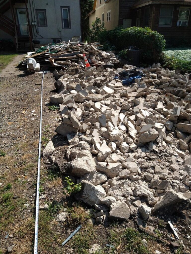 A large pile of concrete demolition debris awaiting removal by Cash For Scrap Vehicles / Junk Removal in Minneapolis, MN.