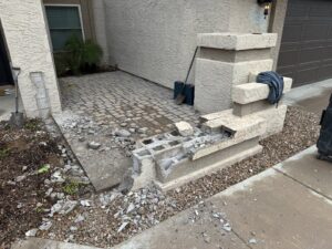 Demolished concrete block structure and rubble on the ground, showing debris removal by HAVOC Demolition in Scottsdale, AZ.