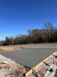 A concrete driveway entrance under construction with forms by Power concrete in Thousand Oaks, CA.