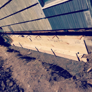 Wooden forms installed for concrete pouring during a foundation repair project by KB Construction NW, Inc. in Springfield, OR.