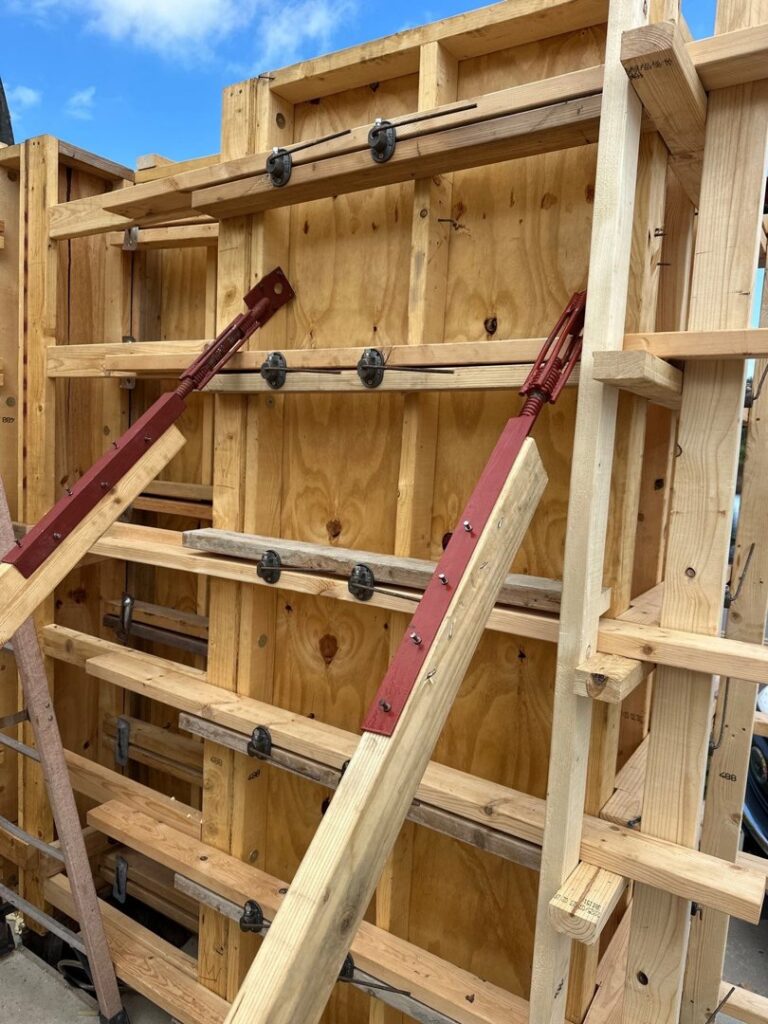 Detailed view of wooden formwork for concrete pouring on a construction site by Bayside Concrete & Construction in Tampa, FL