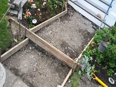 Wooden formwork and a gravel base prepared for a new concrete installation by concrete poured & installed - cp&i in Buffalo, NY.