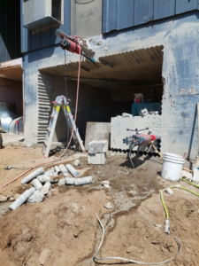 A construction site showing a large opening cut into a concrete foundation by Interstate Sawing & Drilling in Yakima, WA.
